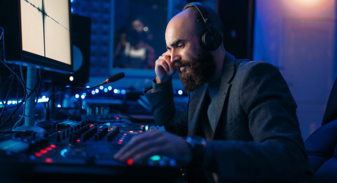 sound-engineer-in-headphones-listens-composition-2021-08-26-16-26-33-utc.jpg
